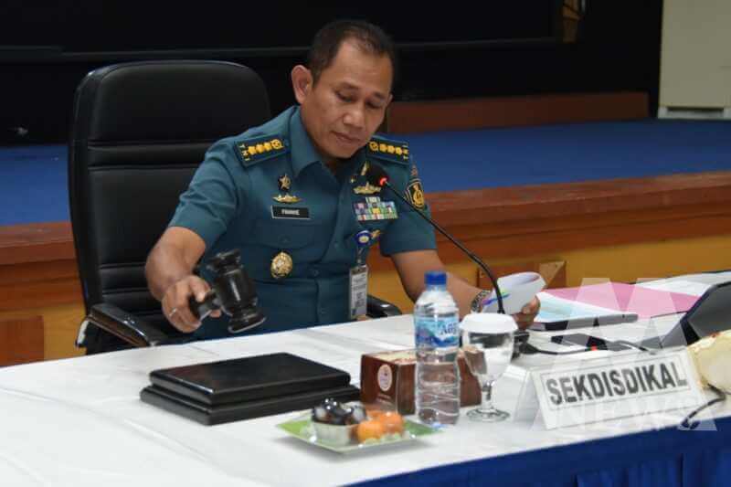 Sekdisdikal, Kolonel Laut (E) Dr. Frankie Oktolim Madethen