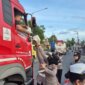 Polwan Polresta Banyuwangi bagi mamiri ke pengguna jalan