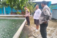 Bhabinkamtibmas Polsek Sukomoro pantau budidaya ikan nila milik warga Pehserut